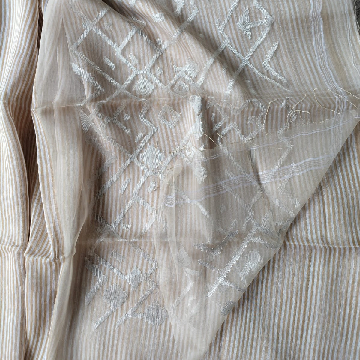 Handwoven beige and white striped silk linen saree with pure muslin palla with intricate jamdani work. Perfect for special occasions and celebrations.