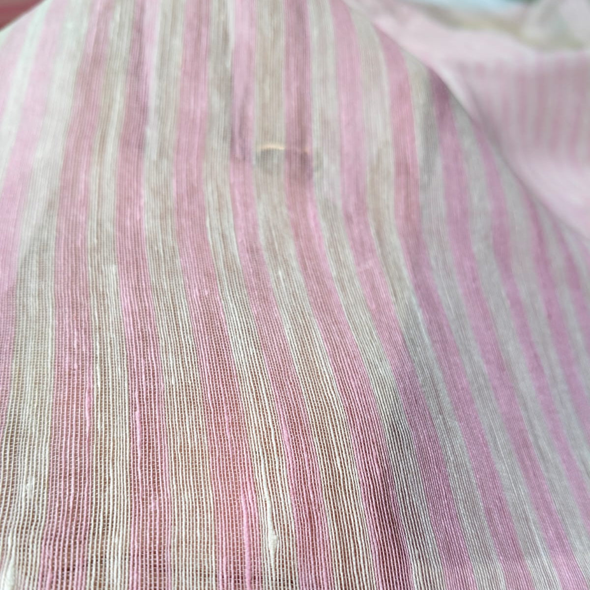 Handwoven pink and white striped silk linen saree with pure muslin palla with intricate jamdani work. Perfect for special occasions and celebrations. 