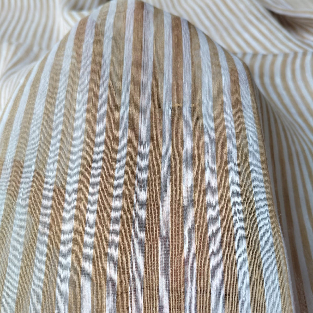 Handwoven beige and white striped silk linen saree with pure muslin palla with intricate jamdani work. Perfect for special occasions and celebrations. 