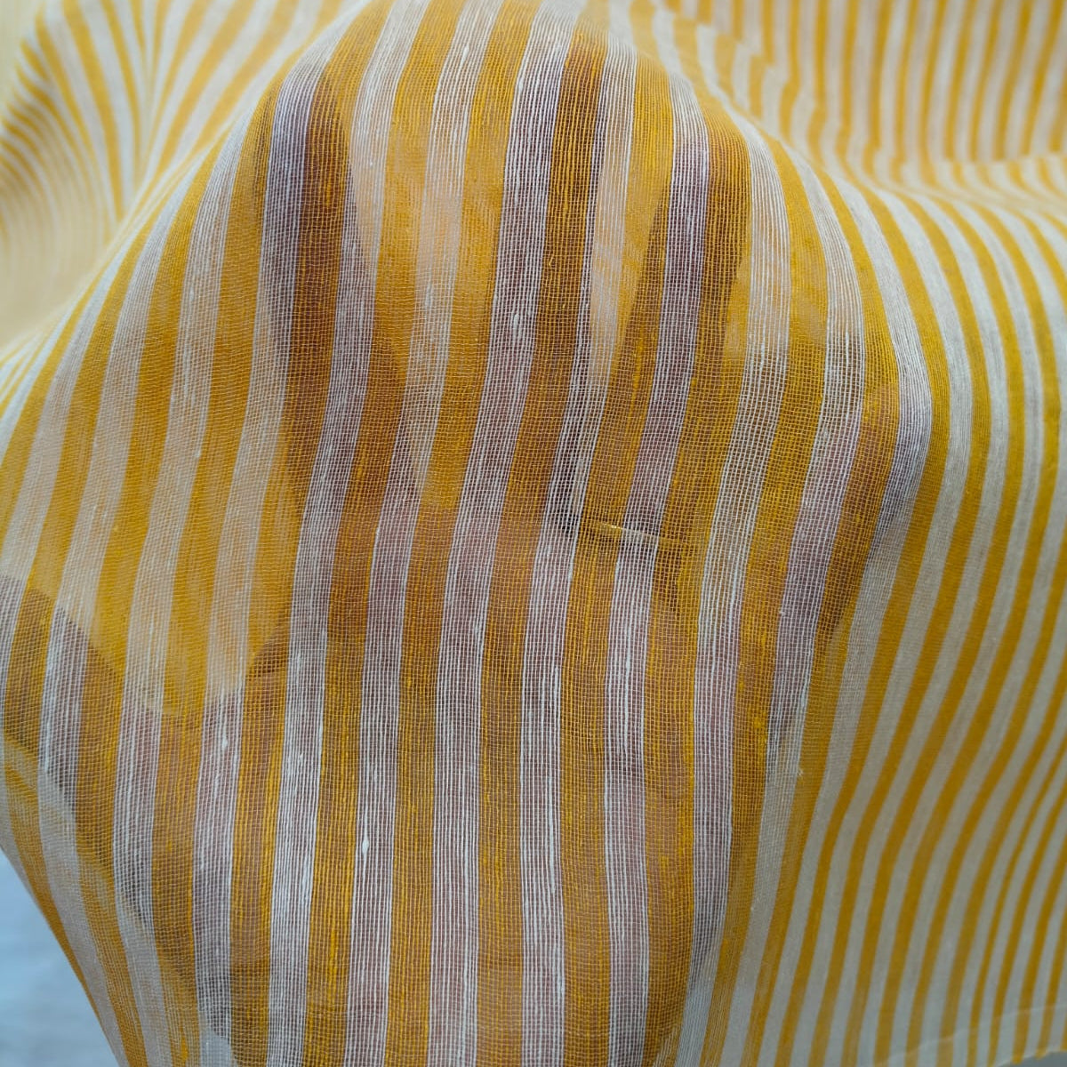 Handwoven yellow and white striped silk linen saree with pure muslin palla with intricate jamdani work. Perfect for special occasions and celebrations. 