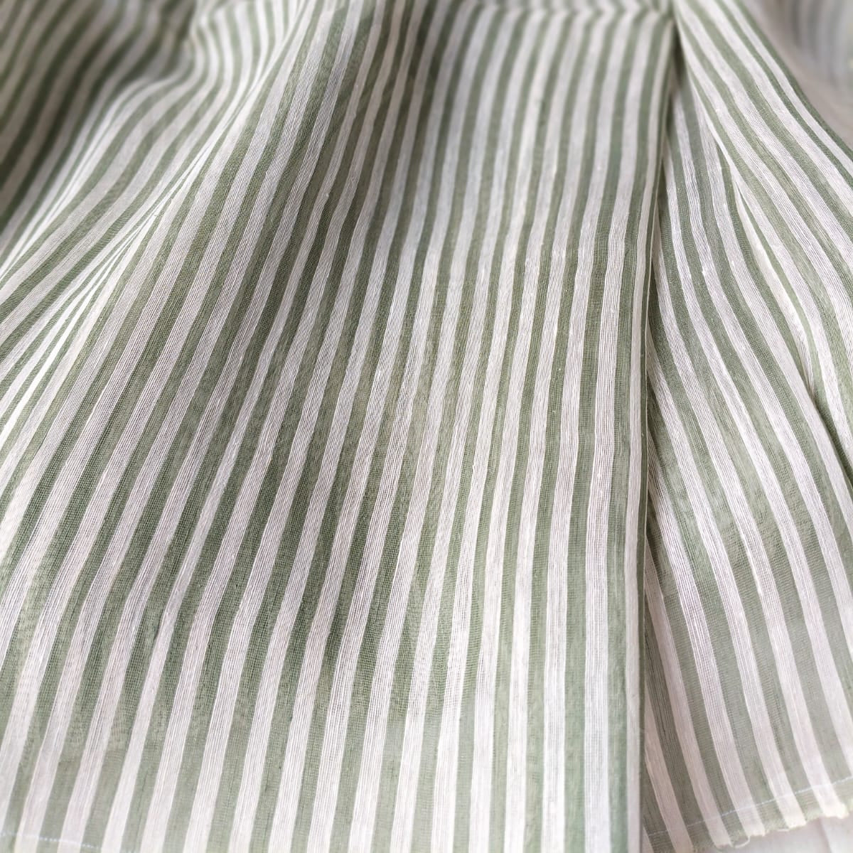 Handloom pure silk linen saree in vertical stripes.  Perfect for festivals, weddings, and special occasions.