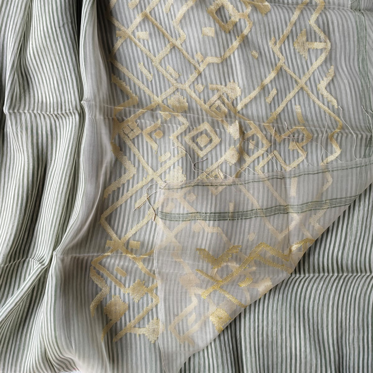 Handloom pure silk linen saree in vertical stripes.  Perfect for festivals, weddings, and special occasions.