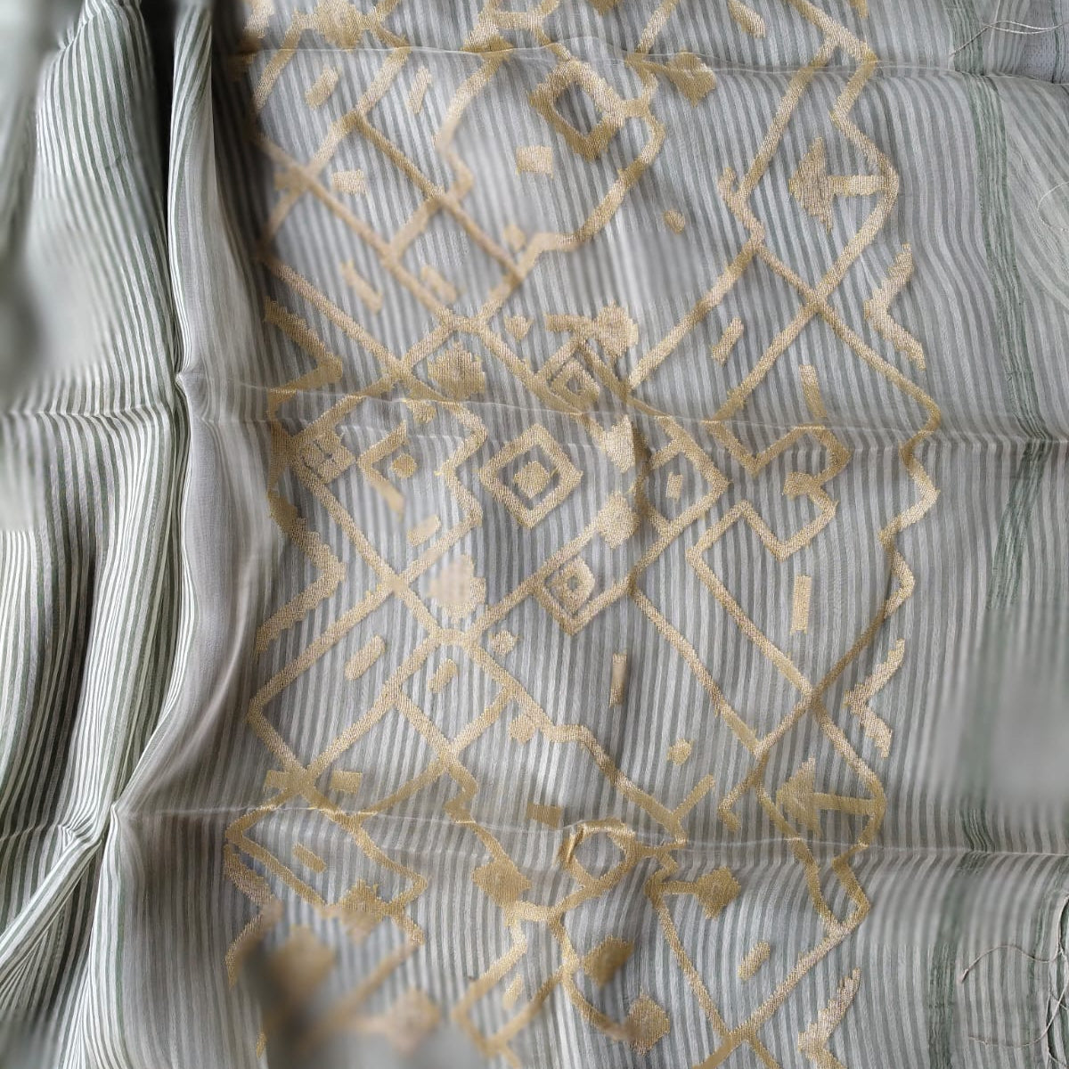 Handloom pure silk linen saree in vertical stripes and handwoven muslin pallu. Perfect for festivals, weddings, and special occasions.