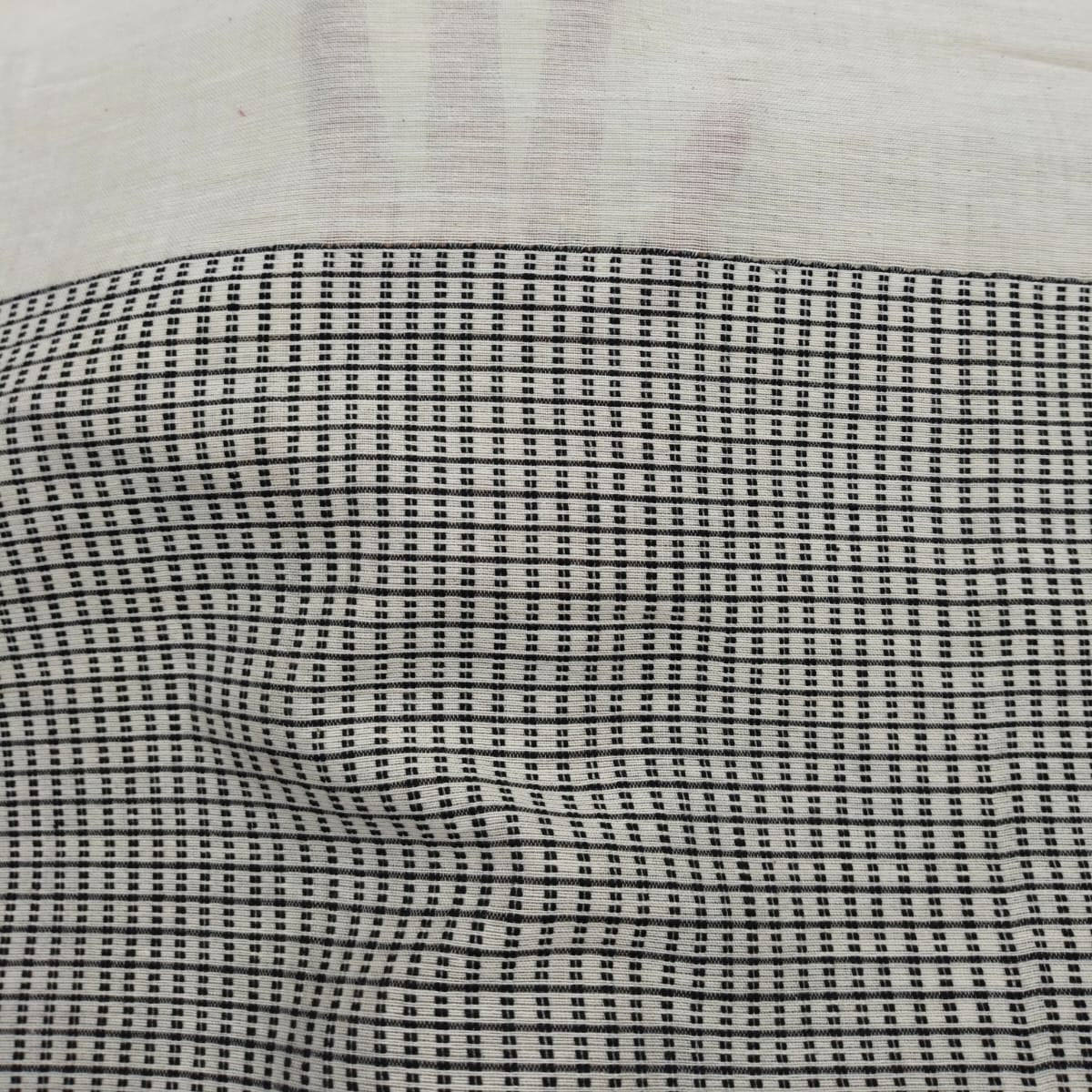 Handloom tagged ivory colour cotton. 