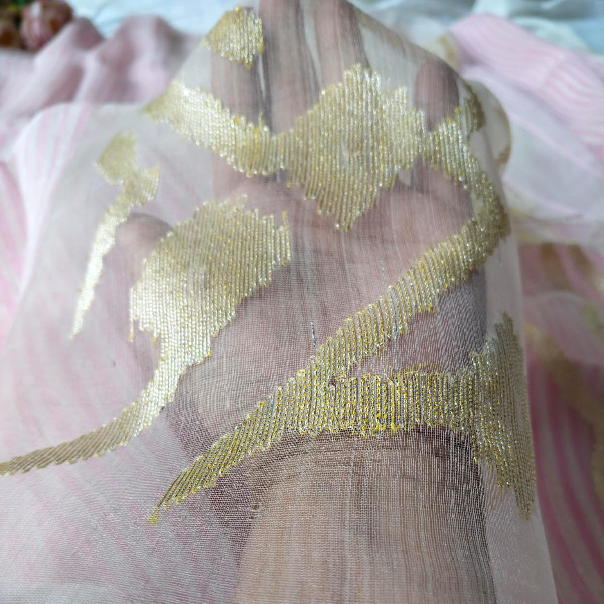 Handwoven pink and white striped silk linen saree with pure muslin palla with intricate jamdani work. Perfect for special occasions and celebrations. 