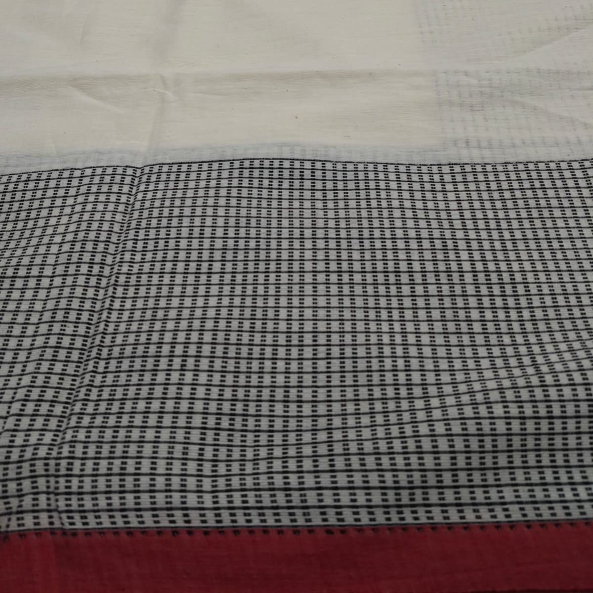 Handloom tagged ivory colour cotton. 